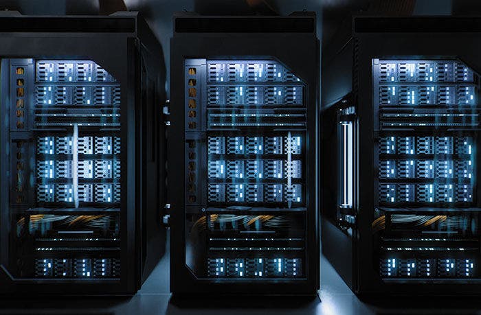 A large hallway with supercomputers inside a server room data center. Technology used for cloud computing and network security.